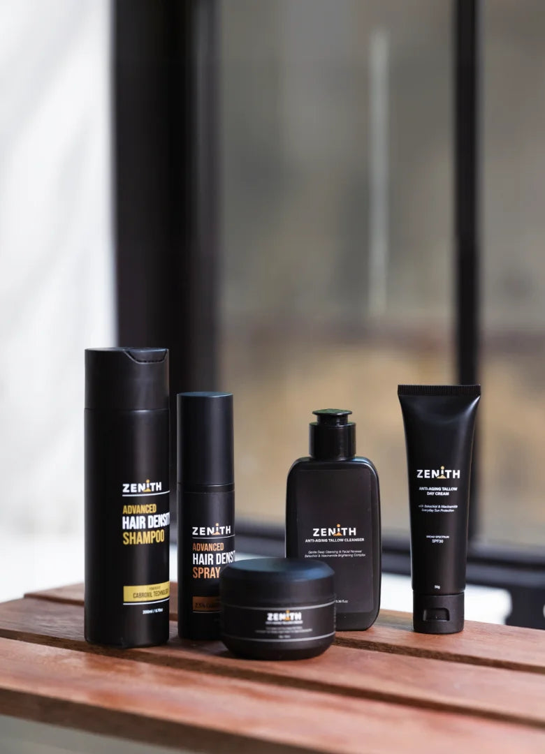 Zenith shampoo, spray, cleanser and creams lined up on a wooden bench by a window